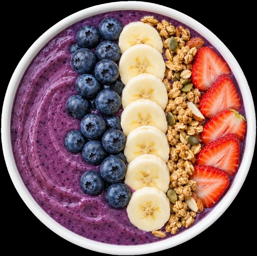 Blueberry smoothie bowl with banana, granola and strawberries